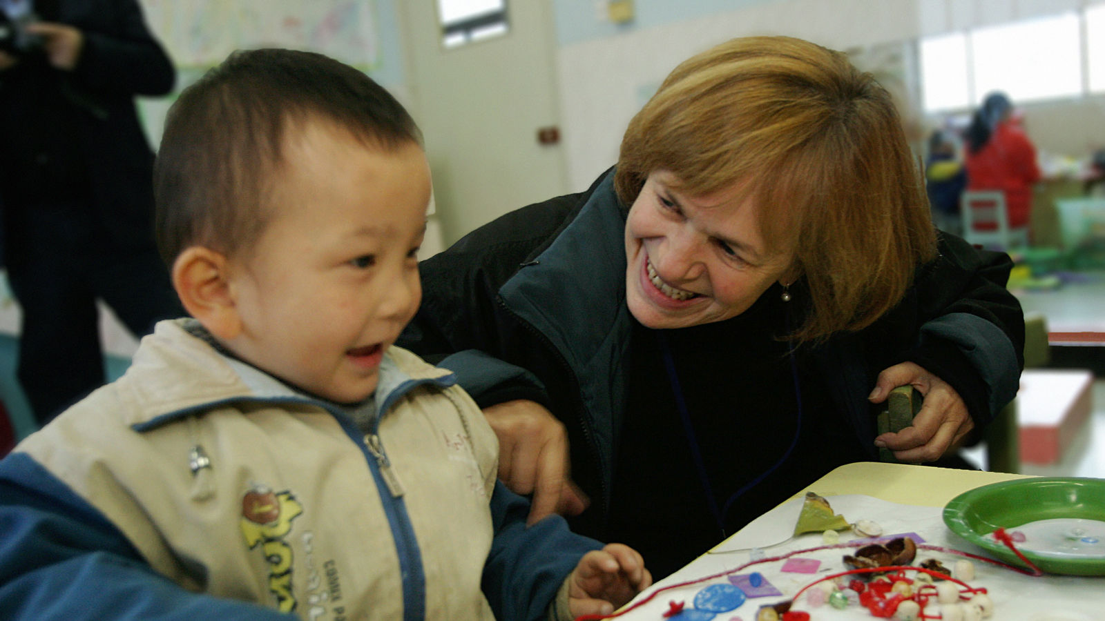 Jenny Bowen with a child at the Half the Sky Preschool Program in Anhui, China.