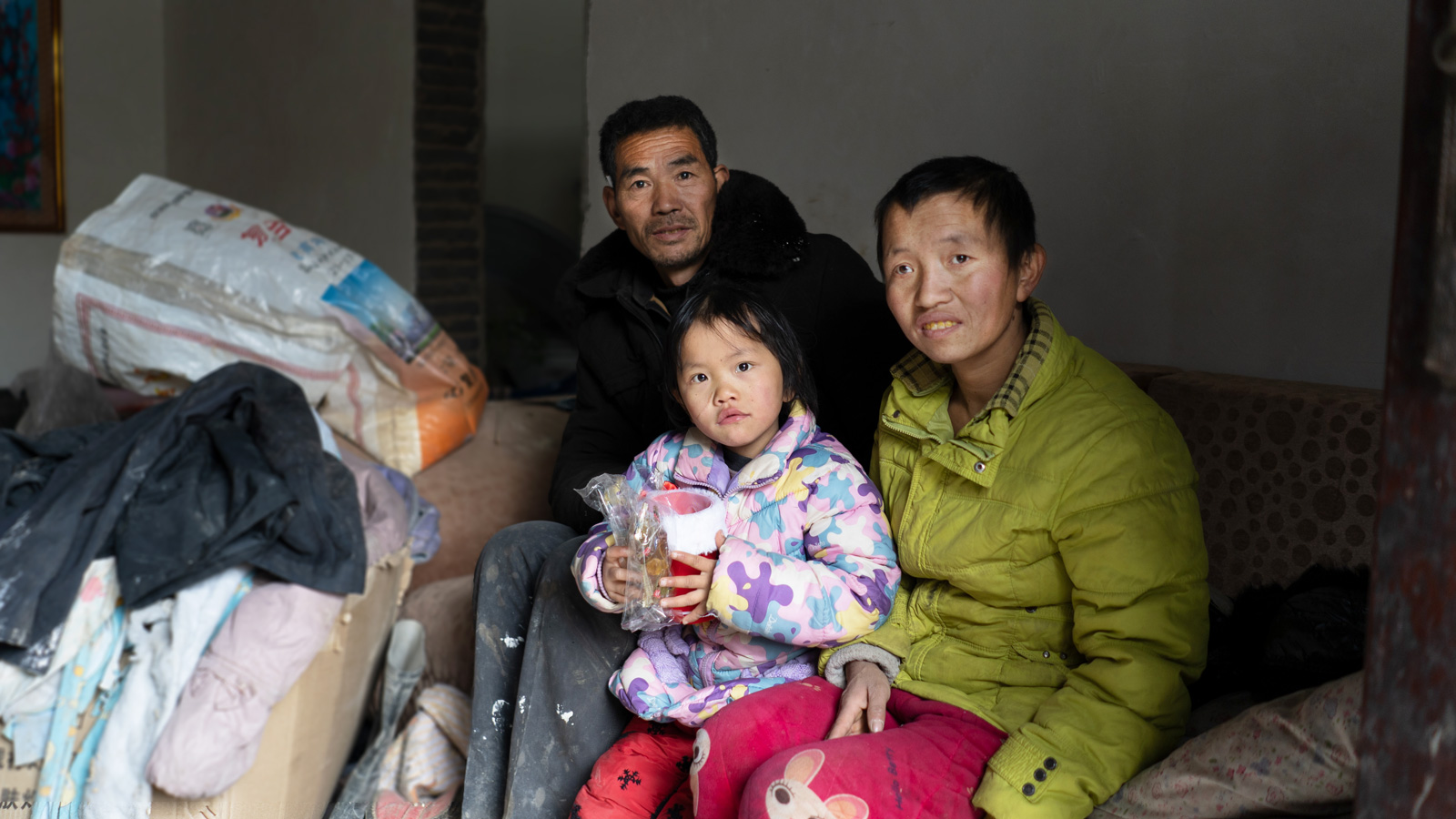 Zhenzhen and her mom and dad at home